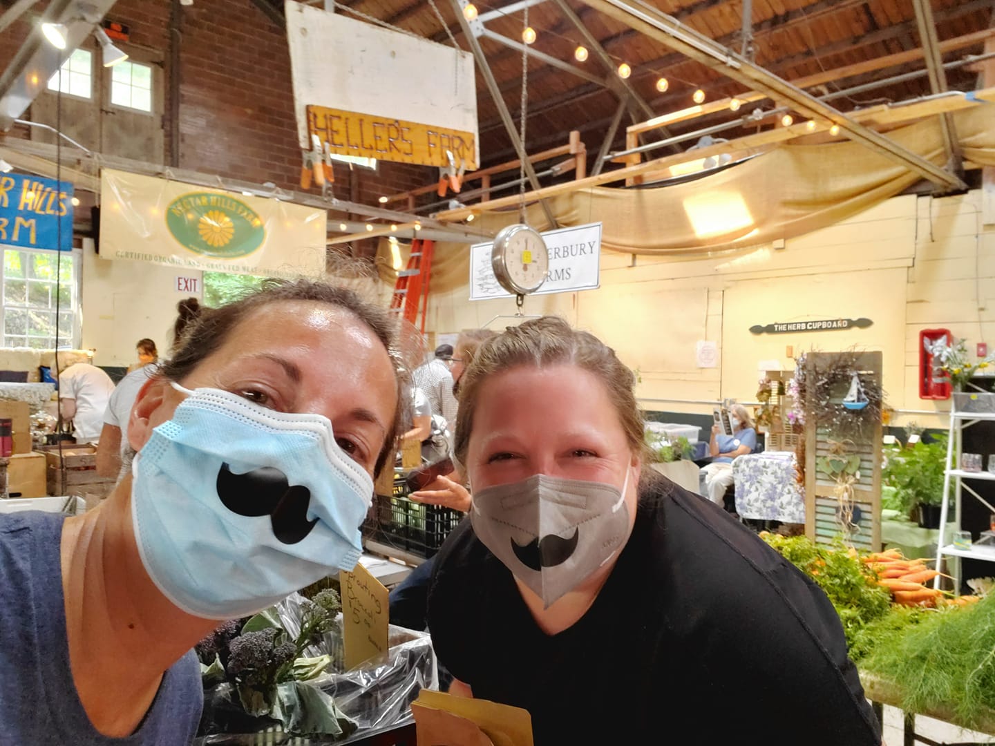 Selfie of 2 women at the farmers market