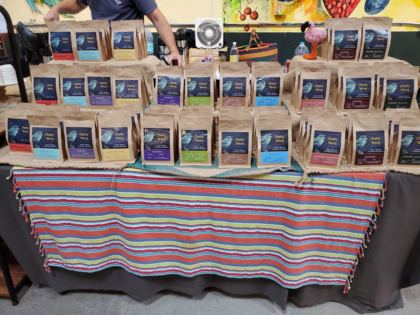 Table with dozens of coffee bags