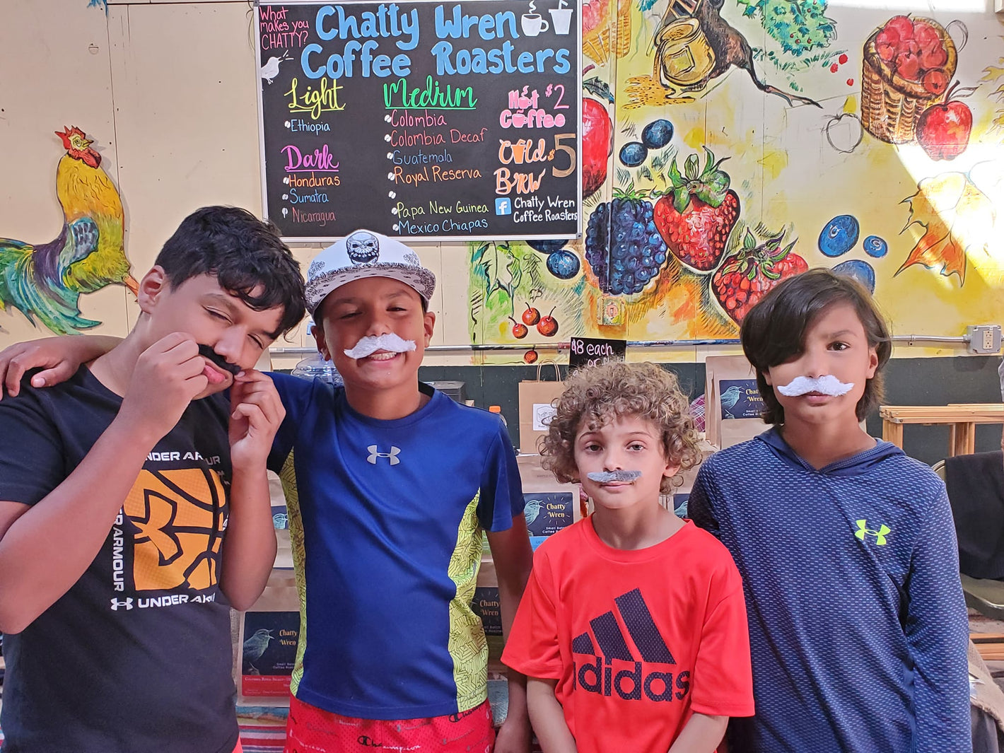 Kids posing with mustaches