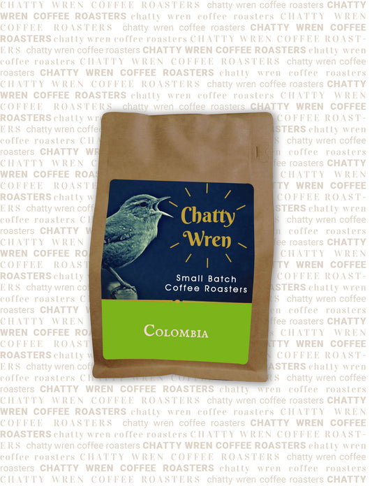 Chatty Wren coffee bag with bright green section that says 'Columbia'
